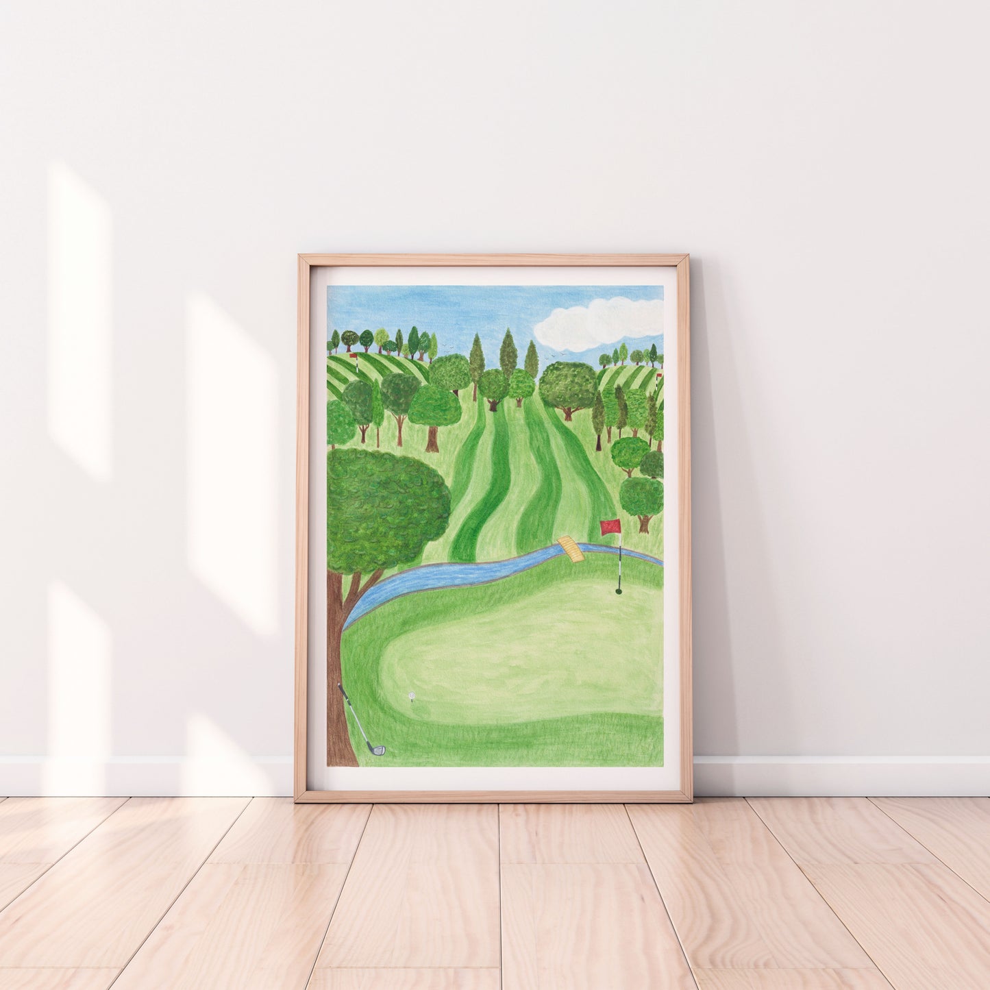 Golf art print. Golf course scene with stripy green fields and trees. Big green tree in the foreground. Blue river across the field. Hand painted with watercolours.